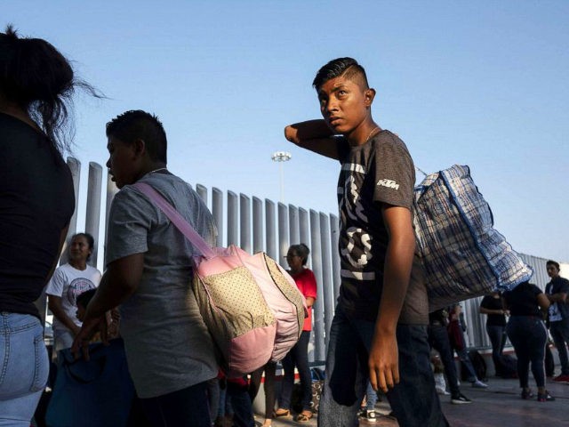 Asylum seekers gather at El Chaparral port of entry in Tijuana, Baja California state, Mexico on August 10, 2018, as they look for an appointment to present their asylum request before the United States authorities. - From the south border with Guatemala to the north border with the United States, …