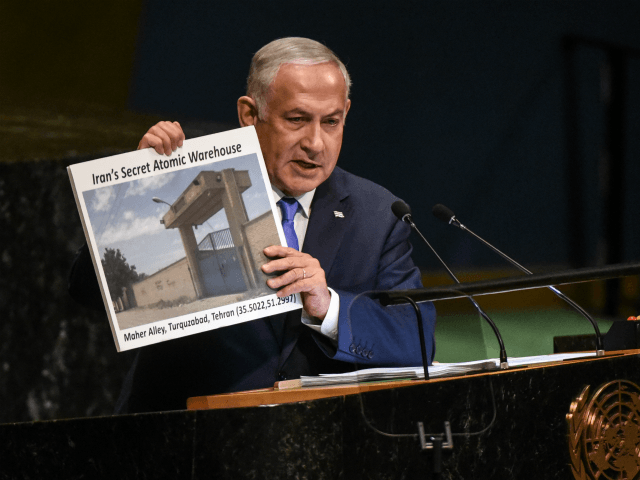 Benjamin Netanyahu, Prime Minister of Israel holds up a placard of a suspected Iranian ato
