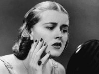pimples Portrait of upset woman looking in hand mirror. (Photo by George Marks/Retrofile/Getty Images)