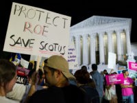 protest-brett-kavanaugh-supreme-court-planned-parenthood-ap FILE - In this July 9, 2018 file photo, demonstrators holds signs as they gather in front of the Supreme Court in Washington after President Donald Trump announced Judge Brett Kavanaugh as his Supreme Court nominee. Worried by the prospect of a reconfigured court, abortion-rights advocates are intensifying efforts to …