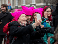 pussy hat Women, wearing the so-called Pussy Hat, pose for a selfie during a rally to mark the International Women's Day in Copenhagen, Denmark on March 8, 2017. / AFP PHOTO / Scanpix Denmark / Nikolai Linares / Denmark OUT (Photo credit should read NIKOLAI LINARES/AFP/Getty Images)