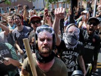 CHARLOTTESVILLE, VA - AUGUST 12: Anti-fascist counter-protesters wait outside Emancipation Park to hurl insluts as white nationalists, neo-Nazis and members of the 'alt-right' are forced out after the 'Unite the Right' rally was declared an unlawful gathering August 12, 2017 in Charlottesville, Virginia. After clashes with anti-fascist protesters and police …