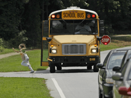 Stoparm cameras intended to catch drivers who illegally passes buses that are picking up or unloading children aren't working in Virginia. A glitch in state prevents the camera tickets from being delivered by mail. Several state lawmakers have proposed bills that would change that. (AP/David Goldman)
