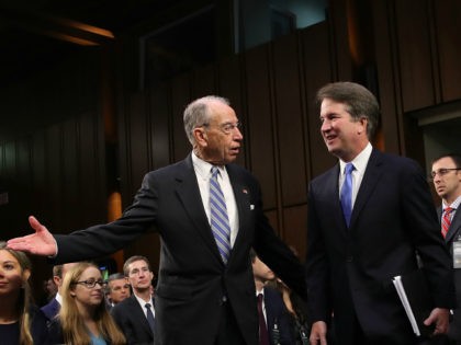 WASHINGTON, DC - SEPTEMBER 05: Senate Judiciary Committee Chairman Chuck Grassley (L) (R-IA) leads Supreme Court nominee Judge Brett Kavanaugh (R) to the witness table at the beginning of Kavanaugh's second day of his confirmation hearing on Capitol Hill September 5, 2018 in Washington, DC. Kavanaugh was nominated by President …