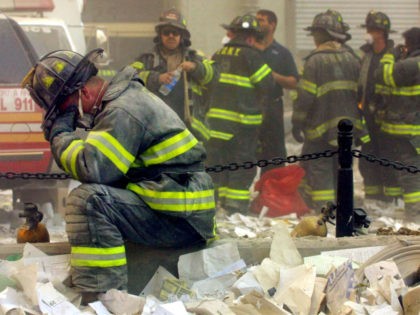 NEW YORK - SEPTEMBER 11, 2001: (SEPTEMBER 11 RETROSPECTIVE) A firefighter breaks down afte
