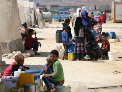 People who fled Syria's Idlib province are pictured at a camp in Kafr Lusin near the borde