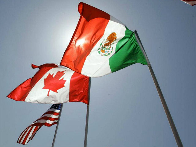 The flags of the United States, Canada and Mexico fly in the breeze at the Louis Armstrong International Airport Monday, April 21, 2008 in New Orleans. The three heads of state, U.S. President Bush, Canadian Prime Minister Stephen Harper, and Mexican President Felipe Calderon, are attending the fourth annual North …
