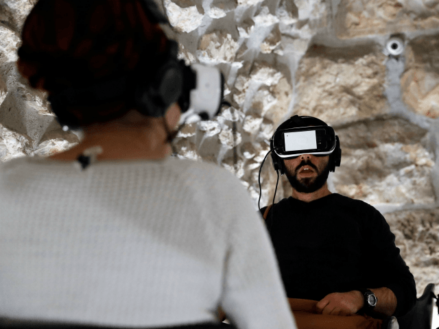 Visitors wear virtual reality headsets as they experience a new virtual reality 360° tour