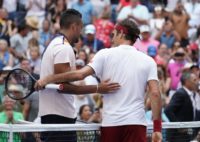 Roger Federer hugs Nick Kyrgios after winning their third round match on Saturday