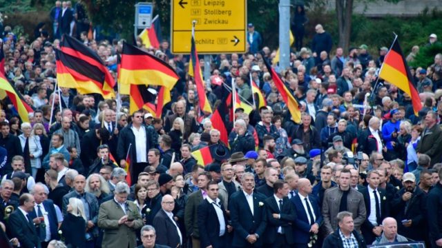 Nine injured in German protests for and against migrants