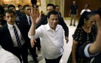 Philippine President Rodrigo Duterte waves on his arrival in Jerusalem at the start of an official visit to Israel, on September 2, 2018
