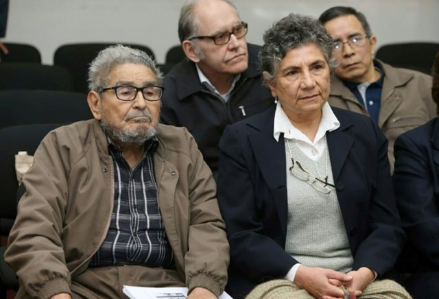Shining Path leftist guerrilla group historic leader Abimael Guzman (L) and his wife Elena Yparraguirre listening to the life sentence at a court hearing Five questions on Peru's Shining Path answered