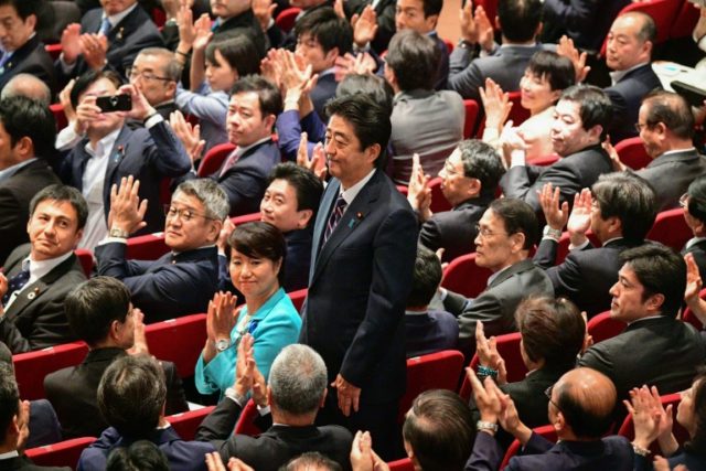 Abe vows to tweak Japan's pacifist constitution after party vote win