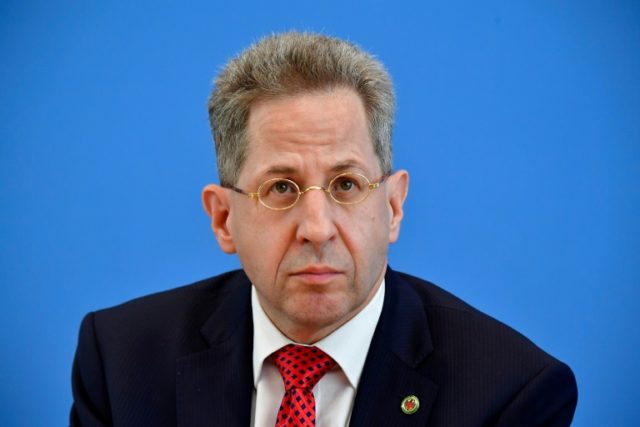 Merkel govt finds new post for spy chief to defuse coalition row