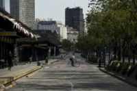 A man rides his bike across the empty 9 de Julio avenue in Buenos Aires, during a 24-hour general strike on September 25, 2018
