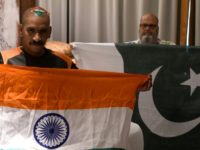 Sudhir Kumar (left) and Mohammad Basheer display their rival India and Pakistan flags in Dubai for the Asian Cup. "Friendship has no boundaries" says Kumar Sudhir Kumar (left) and Mohammad Basheer display their rival India and Pakistan flags in Dubai for the Asian Cup. "Friendship has no boundaries" says Kumar