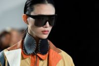 Big sunglasses are in: A Loewe model takes some shades for a spin at Paris fashion week