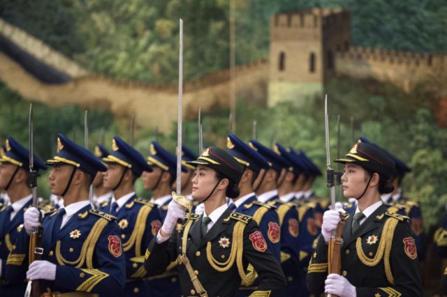 China Ghana Nana Akufo Addo, Xi Jinping Chinese People's Liberation Army honor guard are seen during the welcoming ceremony for Ghana's President Nana Akufo Addo, at the Great Hall of the People Saturday, Sept. 1, 2018. (Nicolas Asfouri/Pool Photo via AP) The Associated Press