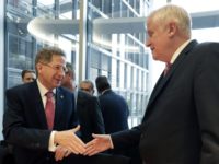 Germany Committee Hans Georg Maassen, left, head of the German Federal Office for the Protection of the Constitution, and German Interior Minister Horst Seehofer, right, shake hands as they arrive for a hearing at the home affairs committee of the German federal parliament, Bundestag, in Berlin, Germany, Wednesday, Sept. 12, 2018. (AP Photo/Michael Sohn) Merkel partners call for removal of German spy chief