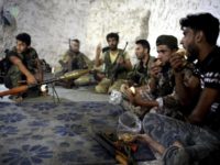 Syria Idlib Fighters In this Sunday, Sept. 9, 2018 file photo, fighters with the Free Syrian army eat in a cave where they live, in the outskirts of the northern town of Jisr al Shughur, Syria, west of the city of Idlib. As the decisive battle for Idlib looms, a motley crew of tens of thousands of Syrian opposition fighters, including some of the world's most radical, are digging their heels looking for ways to salvage what is possible of an armed rebellion that at one point in the seven year conflict controlled more than half of the country. (Ugur Can/DHA via AP, File) Last stand: Syria's rebel Idlib prepares for a losing battle