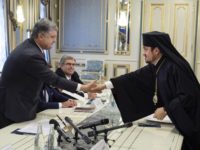Ukraine Religion Ukrainian President Petro Poroshenko, left, and Archbishop Ilarion of Edmonton from Canada shake hands during their meeting in Kiev, Ukraine, Monday, Sept. 17, 2018. The Ecumenical Patriarchate has appointed two exarchs in Kiev for the framework of the preparations for the granting of autocephaly to the Orthodox Church in Ukraine. (Mikhail Palinchak/Presidential Press Service Pool Photo via AP) Orthodox envoys meet with Ukraine's president