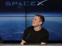 SpaceX Moon In this Feb. 6, 2018 file photo, Elon Musk, founder, CEO, and lead designer of SpaceX, speaks at a news conference after the Falcon 9 SpaceX heavy rocket launched successfully from the Kennedy Space Center in Cape Canaveral, Fla. SpaceX says it’s signed the first private moon traveler. The big reveal on who it is and when the flight to the moon will be is scheduled for Monday, Sept. 17, 2018. (AP Photo/John Raoux) The Associated Press