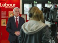 Britain Labour Britain's opposition Labour Party Chancellor of the Exchequer John McDonnell takes a breakfast television interview ahead of his scheduled speech later today at the Labour Party Conference in Liverpool, England, Monday Sept. 24, 2018. The Labour Party confirms Monday it will hold a major debate on Britain's Brexit split from Europe Union at its party conference this week. (Peter Byrne/PA via AP) UK's Labour opposition says it might back new Brexit vote
