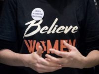 Supreme Court Kavanaugh A woman wears a shirt that reads "Believe Women" with a button that reads "I Believe Dr. Christine Blasey Ford" as protesters against Supreme Court nominee Brett Kavanaugh tell their personal stories of sexual assault outside offices of Sen. Jeff Flake, R Ariz., on Capitol Hill in Washington, Monday, Sept. 24, 2018, as the Senate begins a week of scrutiny of President Donald Trump's nominee to the high court. Judge Brett Kavanaugh's nomination to the U.S. Supreme Court has been further imperiled by a second sexual misconduct allegation, dating to his first year at Yale University. (AP Photo/Andrew Harnik) The Associated Press