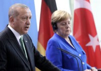 The Latest: Merkel backs four-way meeting on Syria