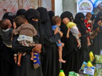 young-yemeni-mothers-food-distribution-18-getty Yemeni women and children wait during food distribution in the province of Hodeida on May 30, 2018. - Hodeida port, Yemen's largest entry point for aid, is now in the crosshairs of the Saudi-led coalition which is intent on cutting off the Huthi rebels from alleged Iranian arms shipments. The …