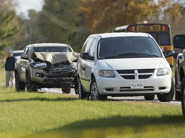 Emergency personnel responded to a scene of a collision that killed three children crossin