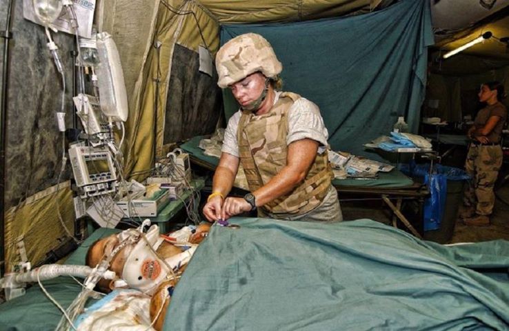 Airman Brian Kolfage receiving treatment after being wounded in combat, losing three limbs