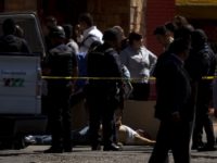 Mexico Violence A man lies dead on the street after being shot by city police in Tijuana, Mexico. (AP File Photo/Guillermo Arias)