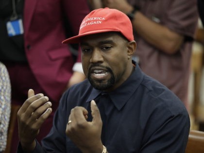 Rapper Kanye West speaks to President Donald Trump and others in the Oval Office of the Wh