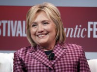 Former Secretary of State Hillary Clinton talks with Jeffrey Goldberg, editor in chief of The Atlantic, during The Atlantic Festival, Tuesday, Oct. 2, 2018, in Washington. (AP Photo/Alex Brandon)