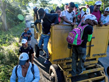 Central American migrants traveling with a caravan to the U.S. make their way to Pijijiapan, Mexico, Thursday, Oct. 25, 2018. The sprawling caravan of migrants hoping to make their way to the United States set off again, forming a column more than a mile long as the group trekked out …