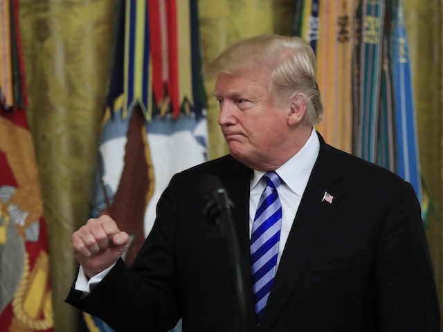 President Donald Trump gestures after giving his speech at a reception commemorating the 3