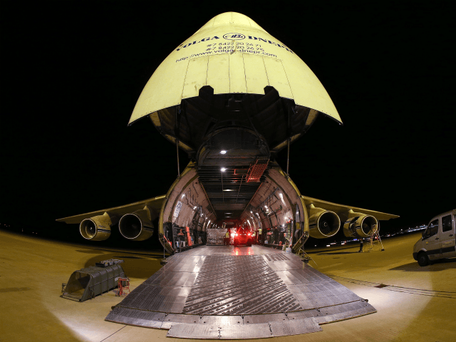 Members of the Bundeswehr, the German armed forces, load an Antonov 124 cargo plane with food and other humanitarian aid destined for Erbil in northern Iraq at the airport Leipzig-Halle on August 22, 2014 in Schkeuditz, Germany. German leaders recently announced they will begin sending weapons as well in order …