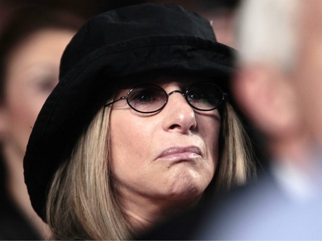 Actress Barbra Streisand is seen in the crowd as she listens to President Barack Obama del