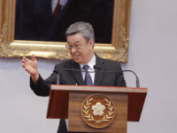 Taiwan's Vice President, Chen Chien-jen (R) reacts as he speaks at a press conference for the newly passed pension reform bill at the presidential office in Taipei on June 21, 2018. - Taiwan's military veterans will see their pensions cut as soon as next month after parliament passed a controversial …