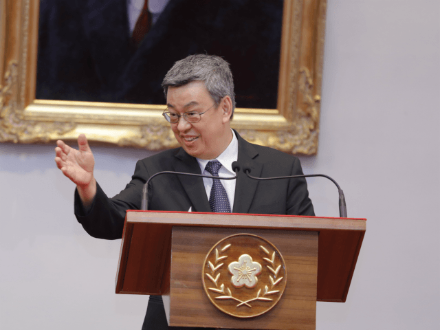 Taiwan's Vice President, Chen Chien-jen (R) reacts as he speaks at a press conference for