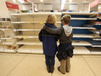 Children at a supermarket TEWKESBURY, UNITED KINGDOM - JULY 23: A mother and her son look at the empty bakery shelves in a supermarket on July 23 2007 in Tewkesbury, England. Flooding has caused wideswept disruption across the country with further regions braced for more floods. (Photo by Matt Cardy/Getty Images)