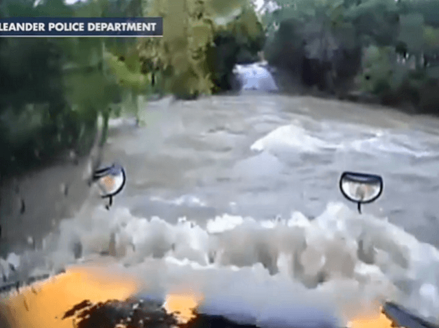 Flooded bus in creek