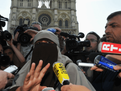 PARIS, FRANCE - APRIL 11: Kenza Drider addresses the media as she demonstrates against the ban of the 'niqab' or full-face veil in public places, on April 11, 2011 in Paris, France. An official ban on wearing the niqab or burka came into effect in France from first thing this …