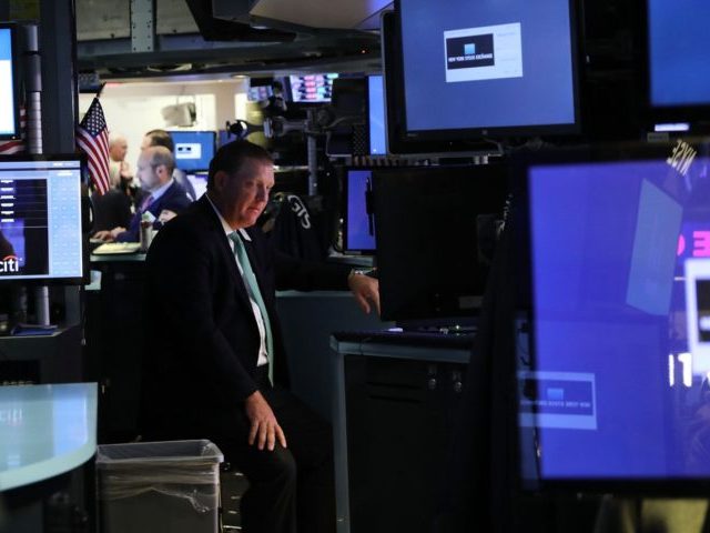 NEW YORK, NY - OCTOBER 04: Traders work on the floor of the New York Stock Exchange (NYSE) on October 4, 2018 in New York City. With bond prices dropping interest rates have been surging resulting in the Dow Jones Industrials Average falling over 200 points at the close. (Photo …