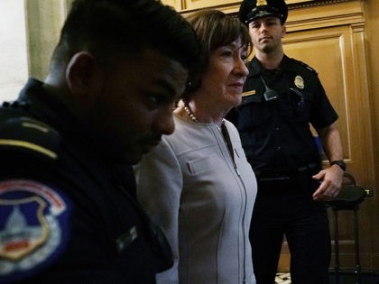 WASHINGTON, DC - OCTOBER 05: Under the escort of U.S. Capitol Police officers, U.S. Sen. S