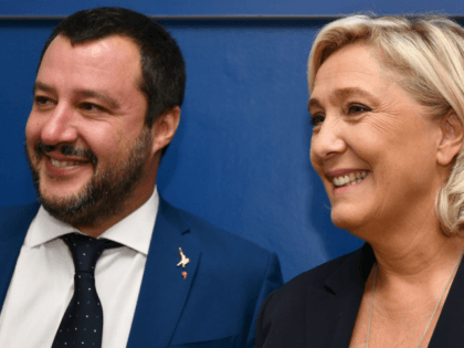 Italy's Interior Minister, Matteo Salvini (L) and leader of France's far-right National Rally (RN) party, Marine Le Pen arrive to hold a press conference within a meeting on the theme 'Economic growth and social prospects in a Europe of Nations' on October 8, 2018 at the headquarters of the Unione …