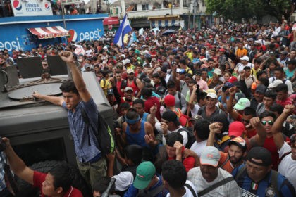Migrant Caravan Crosses Into Mexico From Guatemala CIUDAD TECUN UMAN, GUATEMALA - OCTOBER 19: Members of the migrant caravan push forward at a gate separating Guatemala from Mexico on October 19, 2018 in Ciudad Tecun Uman, Guatemala. The caravan of thousands of immigrants, most from Honduras, pushed open the gate on the Guatemalan side and crossed the …