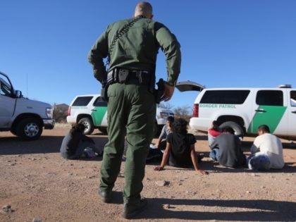 Border Patrol agents arrest migrants in Arizona after they illegally crossed the border from Mexico.