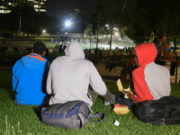 A Belgian kitchen give a meal to refugees and migrants at a park in Brussels on August 22, 2017. Hundreds of migrants, most of them Sudanese and Eritrean, who hope to join the United Kingdom, sleep every night in a park in Brussels. It is a phenomenon that has emerged …